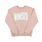 Pink sweatshirt with MINNESOTA spelled out across the front in white bouncy letters, set against a white background.