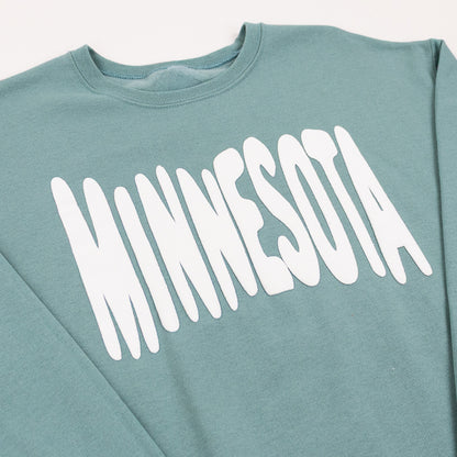 Teal sweatshirt with 'MINNESOTA' printed in white bouncy letters across the front on a white background