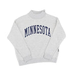 A light heather gray mock neck sweatshirt with 'MINNESOTA' printed in navy blue arched block letters across the chest, displayed flat against a white background.