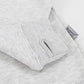 Close-up of a light gray heathered sweatshirt showing a folded cuff with a thumbhole opening and a small gray fabric tag reading 'Baypointe'.