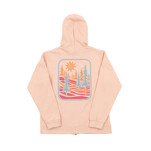 Pink hoodie with a design of colorful pine trees and sun through woods on a white background