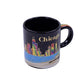 Black mug with colorful Chicago skyline design on a white background