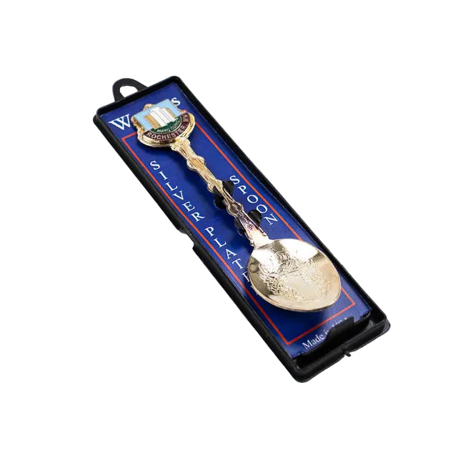 Silver spoon in a blue and white packaging on a white background