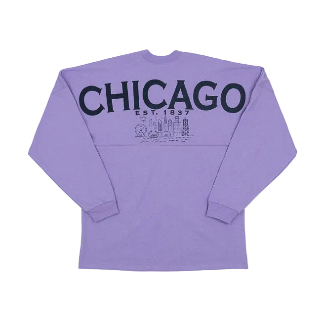 Purple long sleeve shirt with CHICAGO EST. 1837 and a Chicago city skyline across the back, set against a white background.