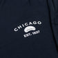 Chicago design featuring CHICAGO EST. 1837 and the Bean in white on a navy shirt.