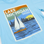 Light blue t-shirt with a graphic of Lake Michigan and Chicago skyline on a white background