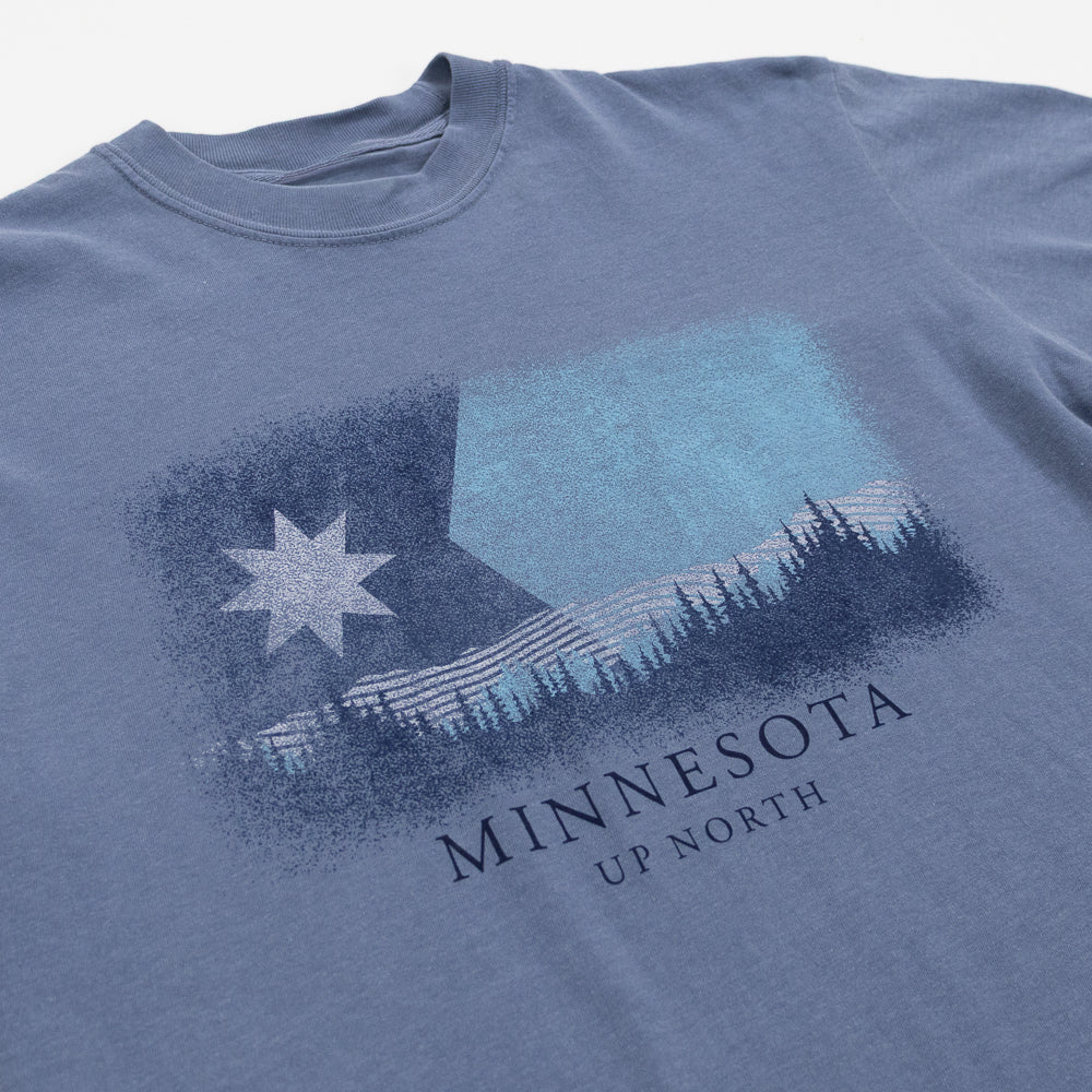 Blue t-shirt with Minnesota graphic design on a white background