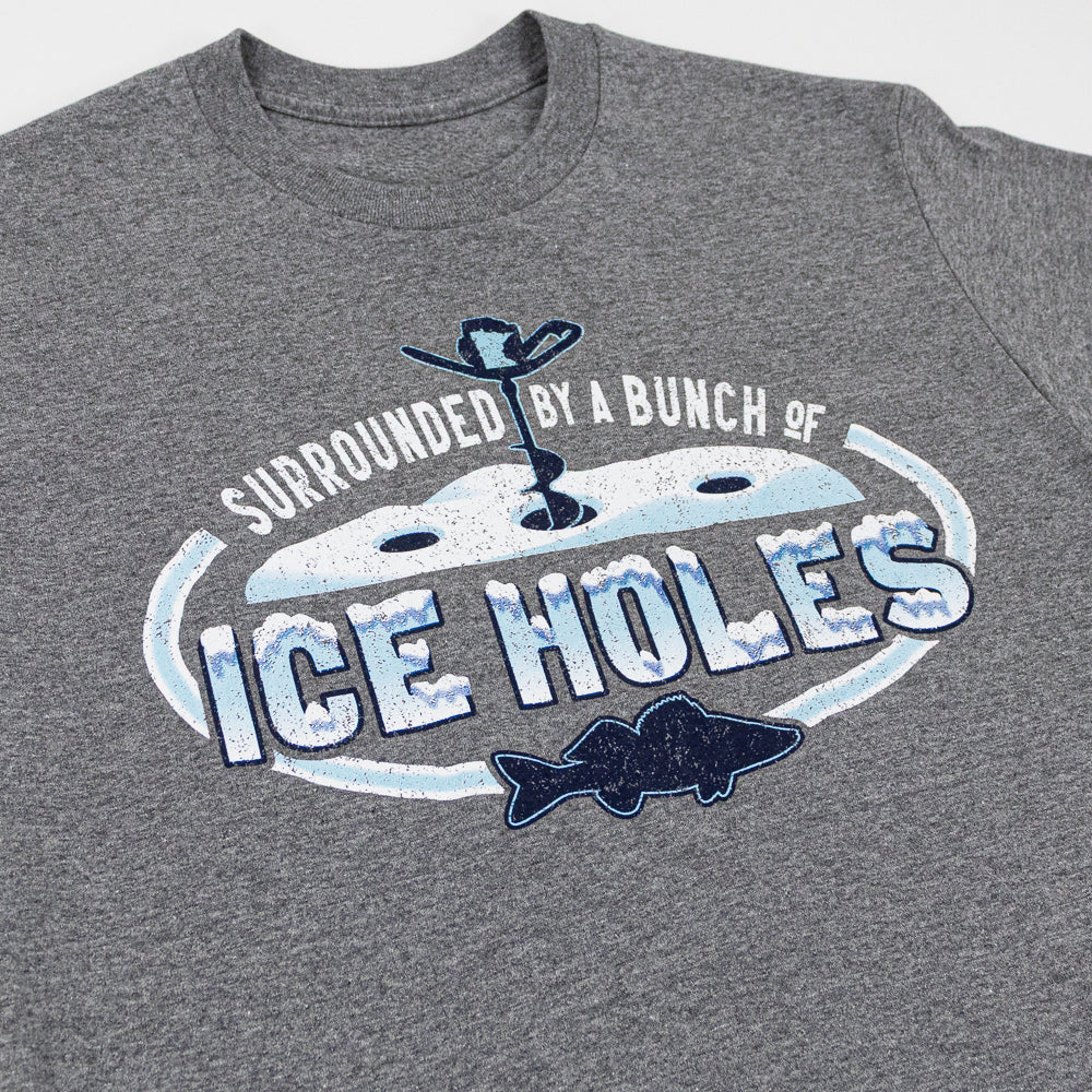 Grey t-shirt with a wintry ice fishing scene and text that reads "Surrounded by a bunch of ice holes."