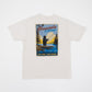 Cappuccino colored t-shirt with a graphic of a bear fishing and 'Minnesota 10,000 Lakes' text on a white background