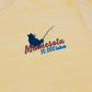Design of a bear fishing and Minnesota 10,000 Lakes text on a mustard yellow t-shirt.