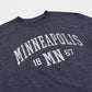 Navy blue t-shirt with 'Minneapolis MN 1867' text on a white background