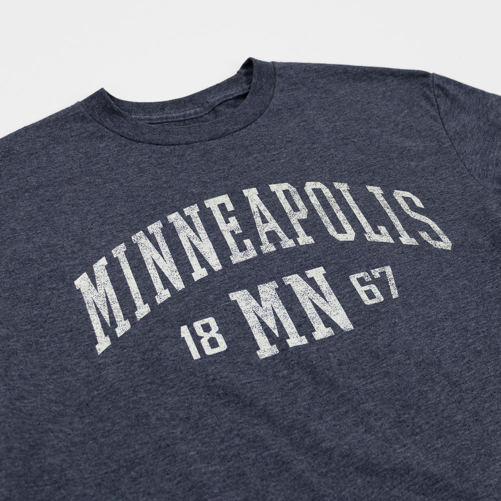Navy blue t-shirt with 'Minneapolis MN 1867' text on a white background