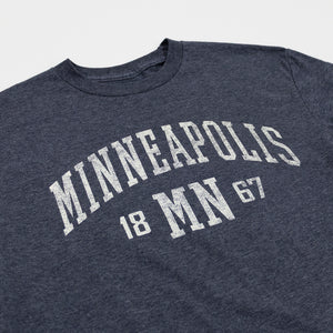 Navy blue t-shirt with 'Minneapolis MN 1867' text on a white background
