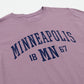 Purple t-shirt with 'MINNEAPOLIS MN 1867' text on a white background