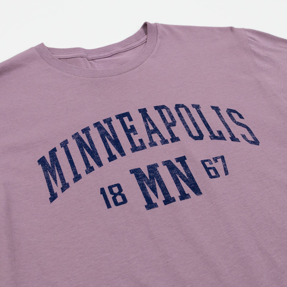 Purple t-shirt with 'MINNEAPOLIS MN 1867' text on a white background