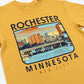 A Mustard colored t-shirt with a city scene and text "Rochester, Minnesota Med City" on a white background.