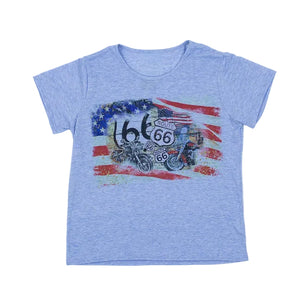 Denim blue t-shirt featuring a USA and Route 66 design on the front including motorcycles and Route 66 highway signs. set against a white backdrop.