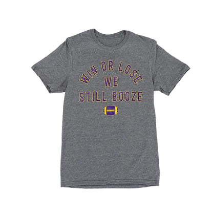 Graphite gray t-shirt with purple and yellow text that reads "Win or Lose We Still Booze" with a football, set against a white background.