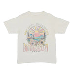 Ivory colored t-shirt with a colorful floral graphic design on a white background