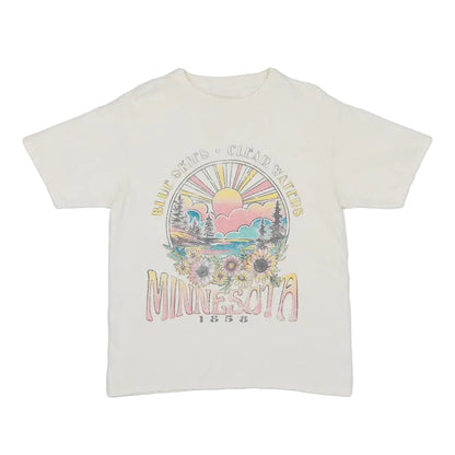 Ivory colored t-shirt with a colorful floral graphic design on a white background