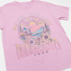 Pink t-shirt with Minnesota graphic design featuring nature elements and text.