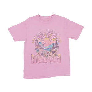 Pink t-shirt with a floral scene graphic design on a white background
