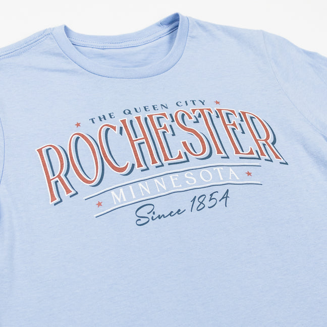 Light blue t-shirt with 'Rochester The Queen City Minnesota Since 1854' text on a white background